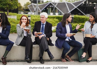 Diverse Business People Eating Together During Lunch Break Outside Of Office