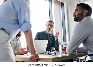 Diverse Business People Executive Team Brainstorming Sharing Ideas With Female Leader Manager At Board Meeting Working In Teamwork, Discussing Company Strategy Plan During Corporate Training.