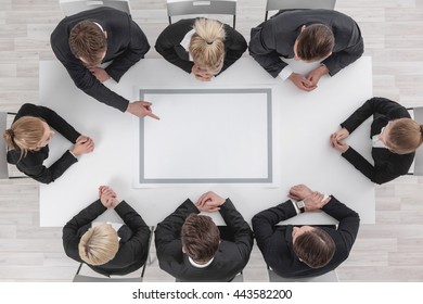 Diverse business people sitting around the table on a meeting