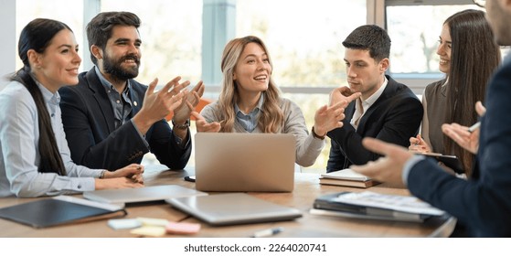 Diverse business people welcoming new employee to their team. Happy friendly business colleagues congratulating to their new coworker. - Shutterstock ID 2264020741