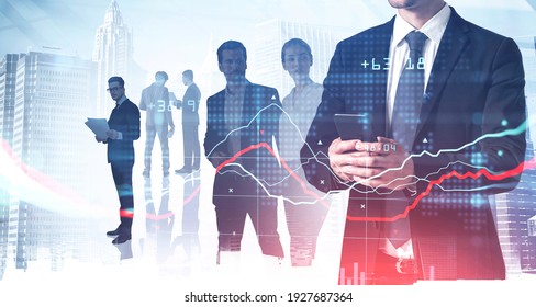 Diverse business people working together, double exposure of falling graph and numbers hologram. Concept of stock market changes and teamwork - Powered by Shutterstock