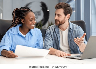 Diverse business project team working together at meeting room at office - Powered by Shutterstock