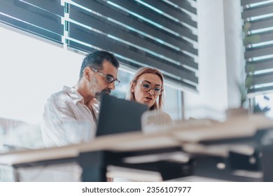 Diverse business team in modern office, analyzing data, creating marketing strategies, and targeting audience for successful campaigns. - Powered by Shutterstock