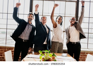 Diverse Business Team Raising Hands Up In The Air