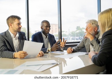 Diverse Business Workgroup Team Discuss In Modern Office