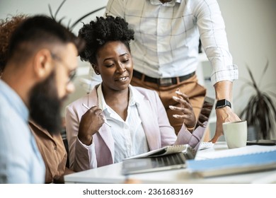 A diverse, casual design team collaborates in the office, creating innovative solutions and fostering in dynamic creative environment.	
 - Powered by Shutterstock