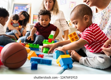 Diverse children enjoying playing with toys - Shutterstock ID 1247691913