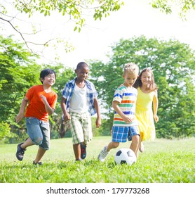 Diverse Children Playing Ball In The Park