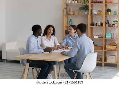 Diverse company teammates gather in office boardroom for negotiations, collaborative project discussion, search business solution look optimistic. Seminar, teamwork, training and seminar event concept