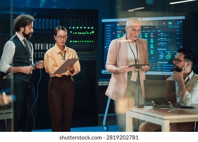 Diverse computing professionals working in a modern data center, collaborating on system administration, network monitoring, and cybersecurity