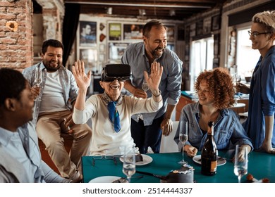 Diverse coworkers using VR during birthday party in office - Powered by Shutterstock