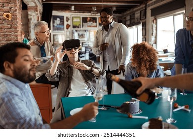 Diverse coworkers using VR during birthday party in office - Powered by Shutterstock