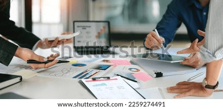 diverse coworkers working together in boardroom, brainstorming, discussing and analyzing and planning business strategy. [[stock_photo]] © 
