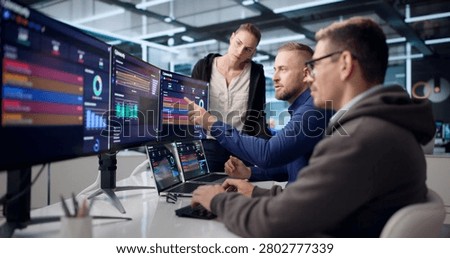Diverse Cybersecurity Team Analyzes Data To Detect And Stop Threats.