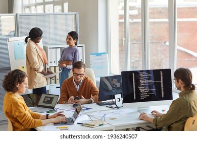 Diverse IT Development Team In Office