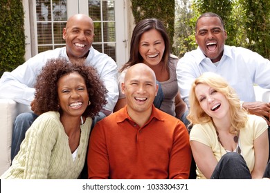 Diverse Ethnic Group Of People Smiling Outside.