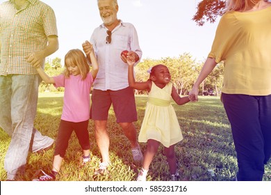 Diverse Family Walking Park Happy Together