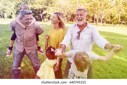 Diverse Family Walking Park Happy Together