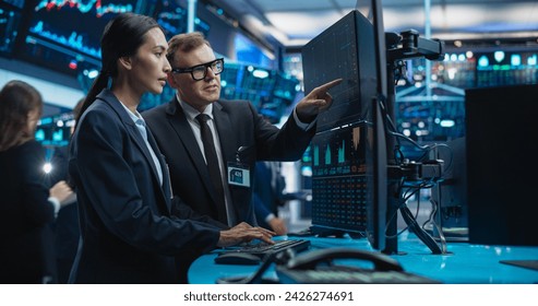 Diverse Female and Male Traders Analyzing Real-Time Financial Data and Reports About the State of the Finance Market. Stock Exchange Professionals Discussing Buy and Sell Options For Different Bonds