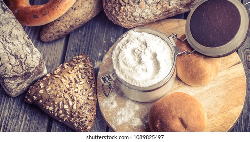 diverse fresh bread on a beautiful wooden background, concept of healthy eating and baking industry - Shutterstock ID 1089825497
