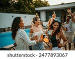 Diverse friends add to the excitement as they join in dancing at the villa pool party