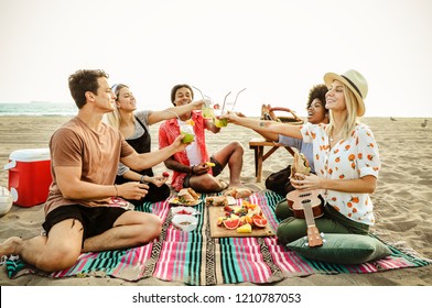 Diverse friends enjoying a beach picnic