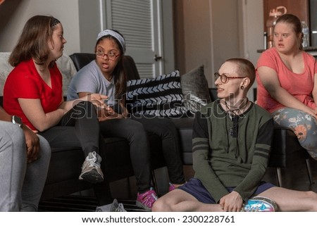 Diverse friends hanging out at home 