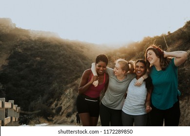 Diverse Friends Hiking Through The Hills Of Los Angeles