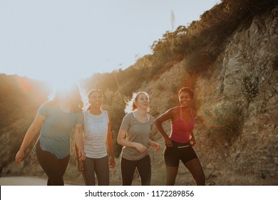 Diverse Friends Hiking Through The Hills Of Los Angeles