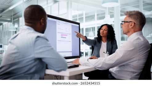 Diverse Group Of Accountants Using Computer To Automate Billing Audit