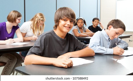 Diverse Group Of Adolescent School Children In Class.  Real Kids In Real Classroom.