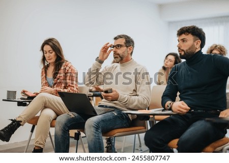 Similar – Image, Stock Photo A focused group of people in casual sportswear engage in stretching exercises before starting their outdoor basketball session