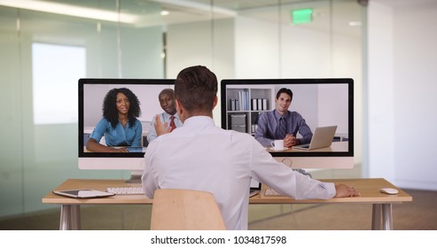 Diverse group of business associates having internet based web conference over video chat - Shutterstock ID 1034817598