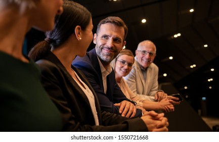 Diverse Group Of Business People Of All Ages Standing Together And Talking