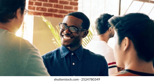 Diverse group in casual attire socializing in a modern loft for new community and connection. Diverse group communicating and networking in a bright for new community and connection. - Powered by Shutterstock