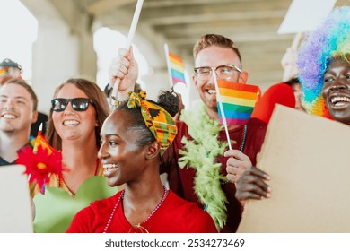 Diverse group celebrating with pride flags. Smiling, joyful faces. Unity and diversity in a vibrant, colorful setting. Pride and celebration together. Diverse group of people celebrating pride month. - Powered by Shutterstock