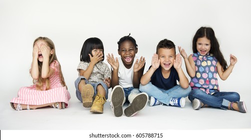 Diverse Group Of Children Doing Peek A Boo Hand Gesture