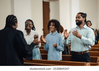 Diverse group of churchgoers clapping and singing joyfully to gospel music in a vibrant church service, showcasing unity and diversity within the christian faith - Powered by Shutterstock