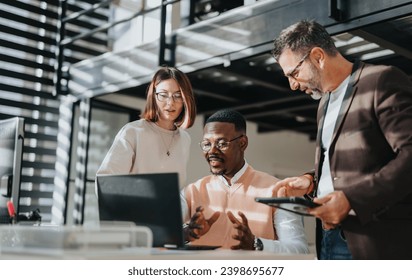 A diverse group collaborates on business growth, discussing market analysis and global expansion. They work together in a corporate office, strategizing for success and sustainability. - Powered by Shutterstock