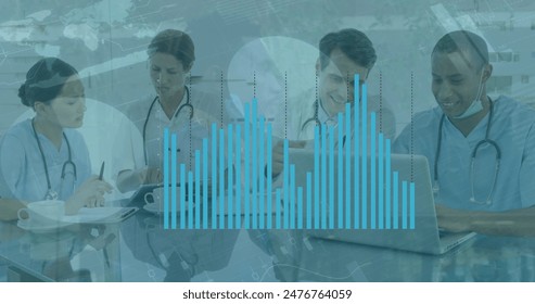A diverse group of colleagues in medical attire are working on laptops and tablets. They are in modern office with a large graph overlay on image, indicating data analysis - Powered by Shutterstock