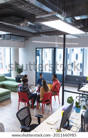 Similar – Group of young adults having business meeting in start up office