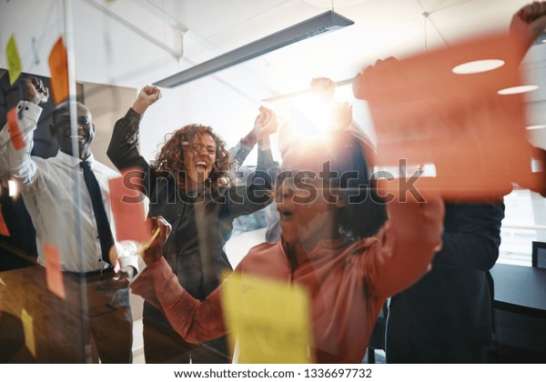 Diverse Group Ecstatic Businesspeople Cheering Jumping Stock Photo