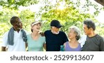 Diverse group of elderly friends enjoying exercise outdoors. Elderly friends, diverse group exercise in park. Diverse elderly friends exercise together. Happy elderly friends in park, healthy exercise