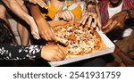 Diverse group enjoying pizza together, hands reaching for slices. Casual gathering, pizza party vibe, sharing food, diverse hands, pizza lovers. Christmas and New Year party.