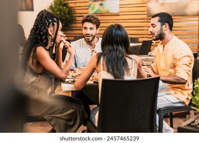 Diverse group of friends - enjoying dinner and conversation at a restaurant, sharing a meal in a lively urban setting - social, fun. - Powered by Shutterstock