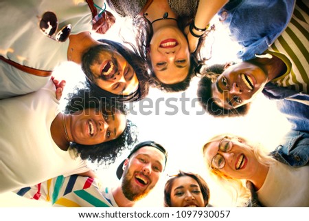 Similar – Young happy people with their heads together having fun in summer party