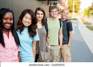 Diverse Group Of Friends In A Line Smiling