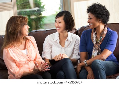 Diverse Group Of Friends Talking And Laughing.