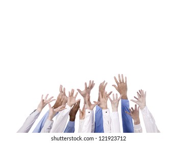 Diverse Group Of Hands Reaching For Something Over The White Background