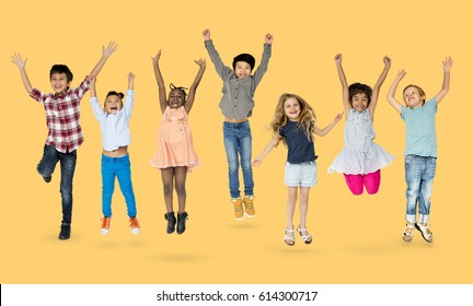 Diverse Group Of Kids Jumping And Having Fun